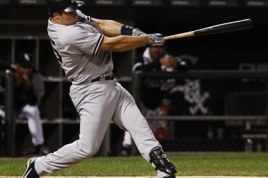 New York Yankees&#039; Teixeira hits a home run against the Chicago White Sox during their MLB American League baseball game in Chicago