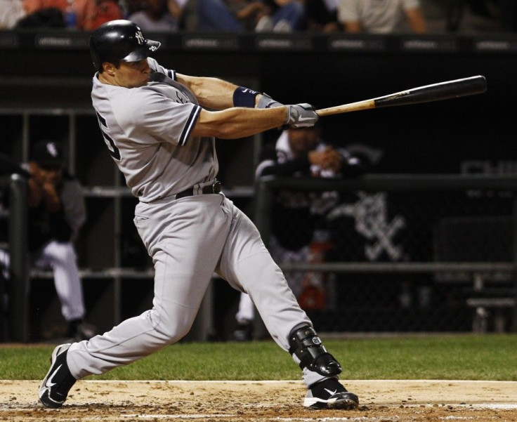 New York Yankees&#039; Teixeira hits a home run against the Chicago White Sox during their MLB American League baseball game in Chicago