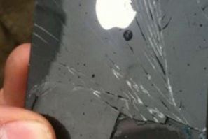 The photo of the damaged iPhone shows Steve Jobs&#039; silhouette etched into the Apple logo. Apple says it has never made a back panel like this.