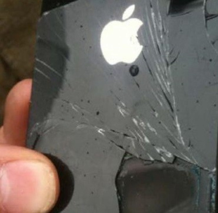 The photo of the damaged iPhone shows Steve Jobs&#039; silhouette etched into the Apple logo. Apple says it has never made a back panel like this.
