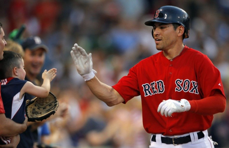 Boston Red Sox Ellsbury high fives a young fan after hitting a home run against the Seattle Mariners in their MLB game in Boston