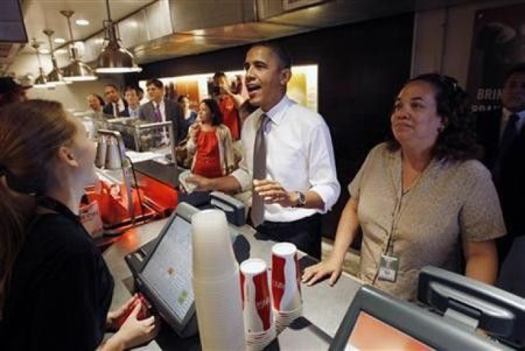 U.S. President Barack Obama orders an hamburger and fries at the Good Stuff Eatery on Capitol Hill in Washington, August 3, 2011.