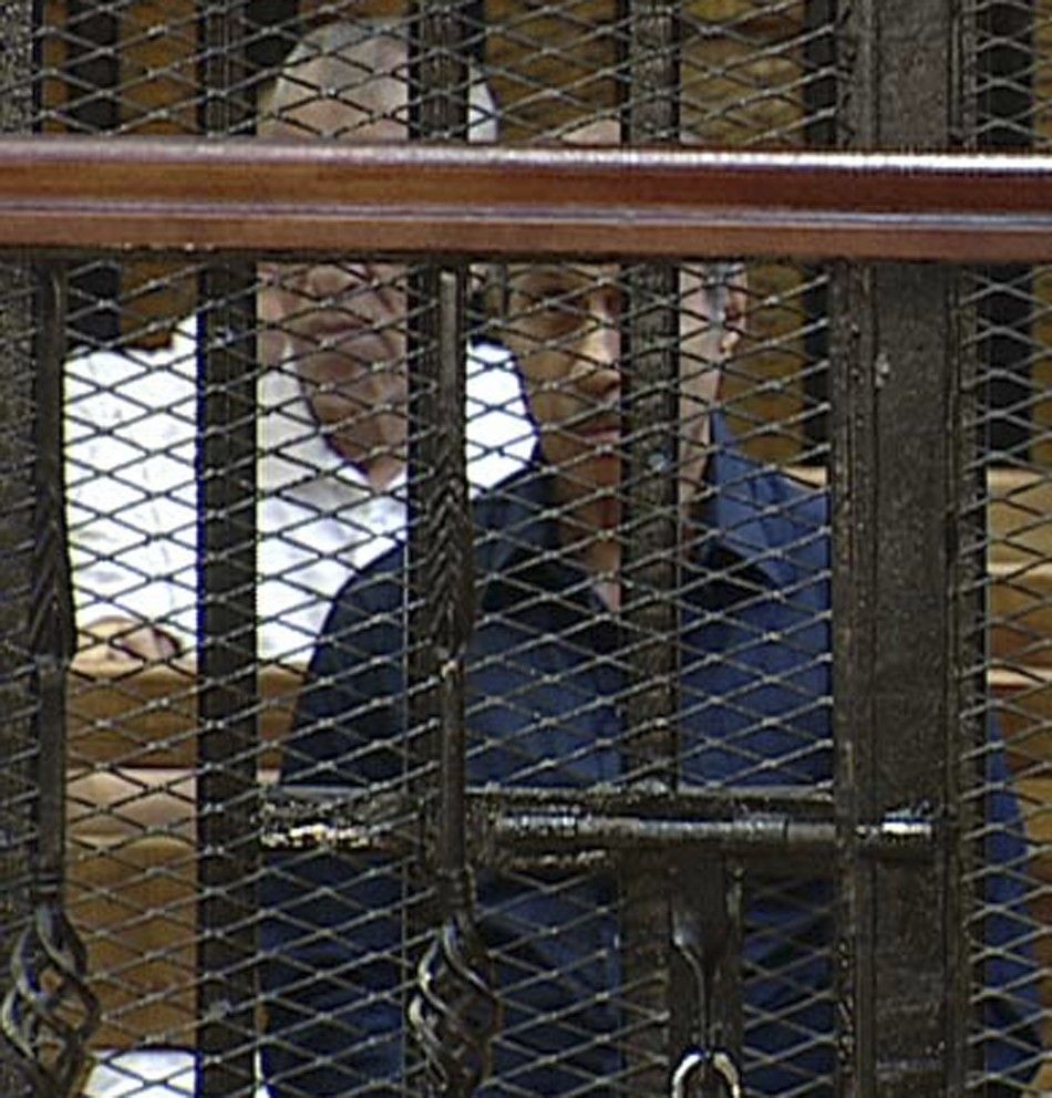 Former Egyptian interior minister Habib al-Adli sits in the courtroom during his trial at the Police Academy in Cairo