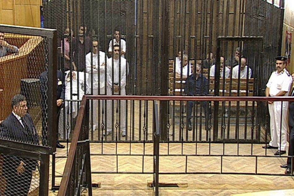 Defendants including Egypts former president Mubarak, his two sons Gamal and Alaa Mubarak, and former interior minister al-Adli attend their trial in Cairo