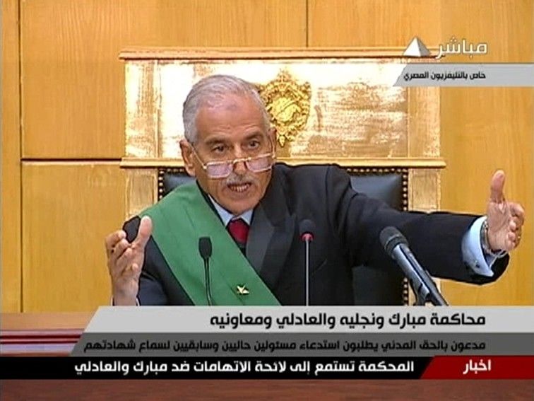 Judge Ahmed Refaat speaks in the courtroom during the trial of former Egyptian President Hosni Mubarak at the Police Academy in Cairo in this still image taken from video