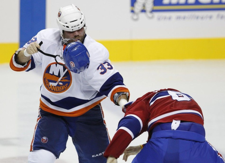 Islanders&#039; Yablonski fights Canadiens&#039; Spacek during the third period of play in their NHL pre-season hockey game in Quebec City