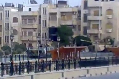 Video grab of a tank along a street in Hama