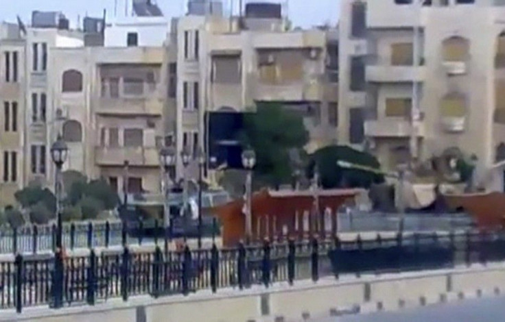 Video grab of a tank along a street in Hama