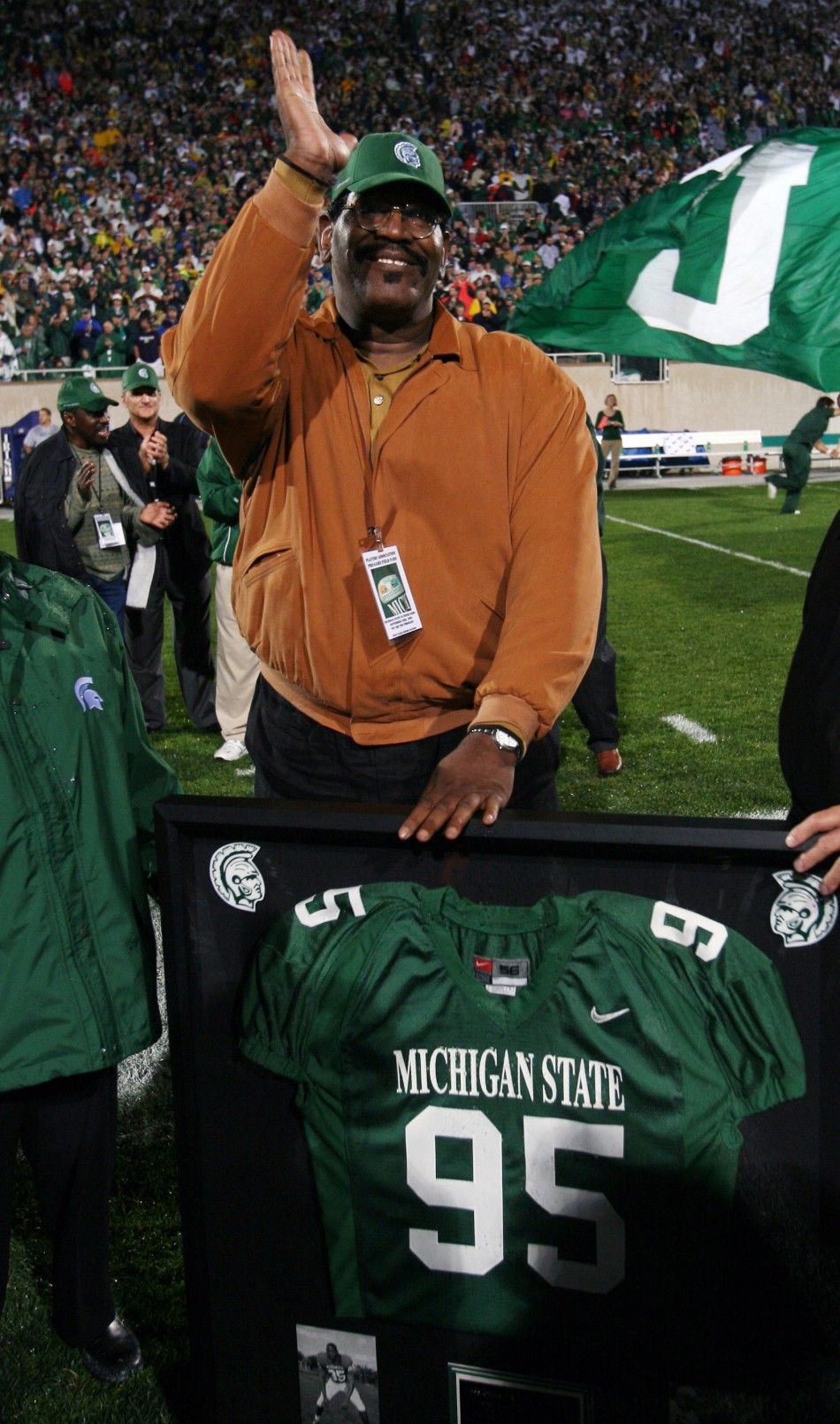 Former Michigan State football player and actor Smith reacts to having his jersey number retired in East Lansing Michigan
