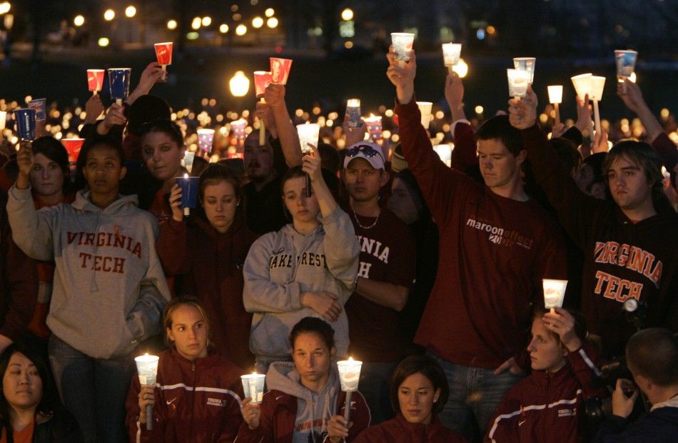 Mourners grieve at a candlelight vigil for the victims of the Virginia Tech shootings in Blacksburg 