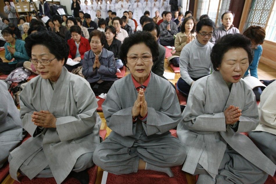 People pray in Seoul 