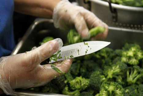 A worker prepares some of the more than 8,000lbs of locally grown broccoli from a partnership between Farm to School and Healthy School Meals at Marston Middle School in San Diego