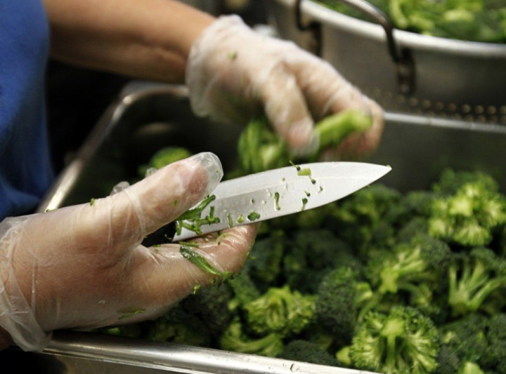 A worker prepares some of the more than 8,000lbs of locally grown broccoli from a partnership between Farm to School and Healthy School Meals at Marston Middle School in San Diego