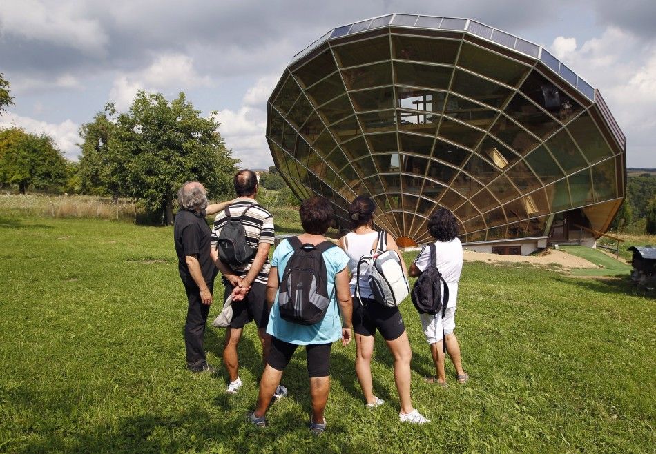 Visitors look at the Heliodome, a bioclimatic solar house build in Cosswiller in the Alsacian countryside near Strasbourg, Eastern France