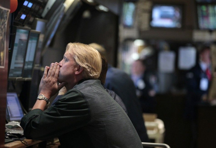 Traders work on the floor of the New York Stock Exchange