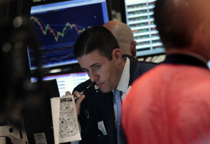 Traders work on the floor of the New York Stock Exchange