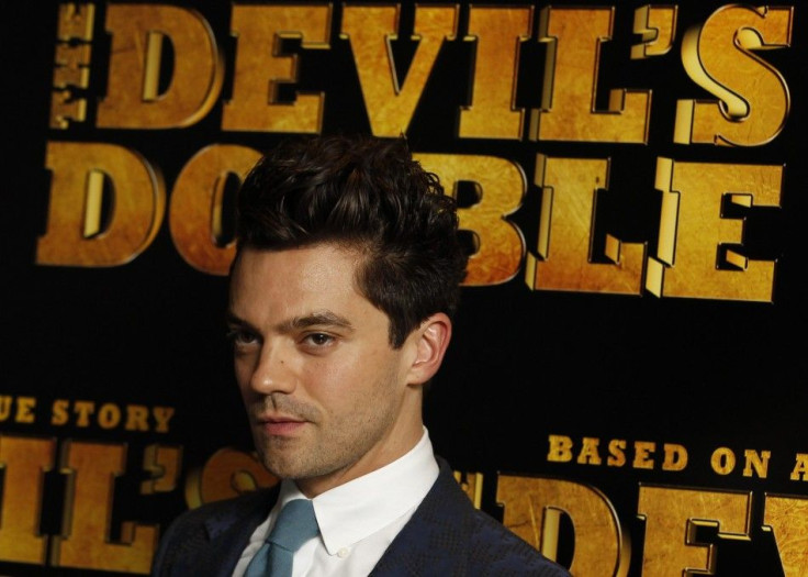 Actor Dominic Cooper poses for photographers at the British Premiere of "The Devil's Double", in London