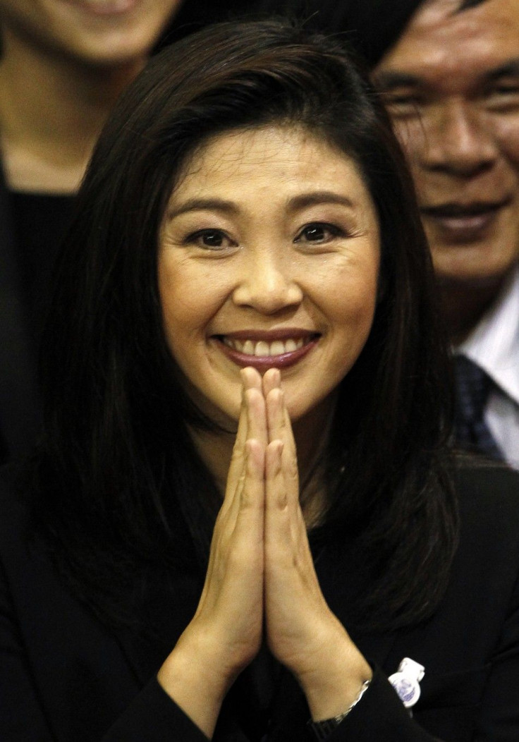 Thailand's new PM Shinawatra of the Puea Thai Party gestures to members of parliament moments after being elected as the country's 28th prime minister in Bangkok