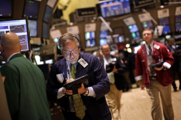 Traders work on the floor of the New York Stock Exchange