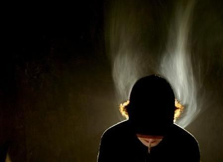 A teenager smokes a cigarette in this file photo.