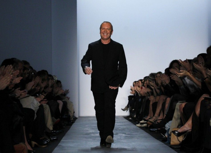 Designer Michael Kors walks the runway following the presentation of his Fall/Winter 2011 collection during New York Fashion Week