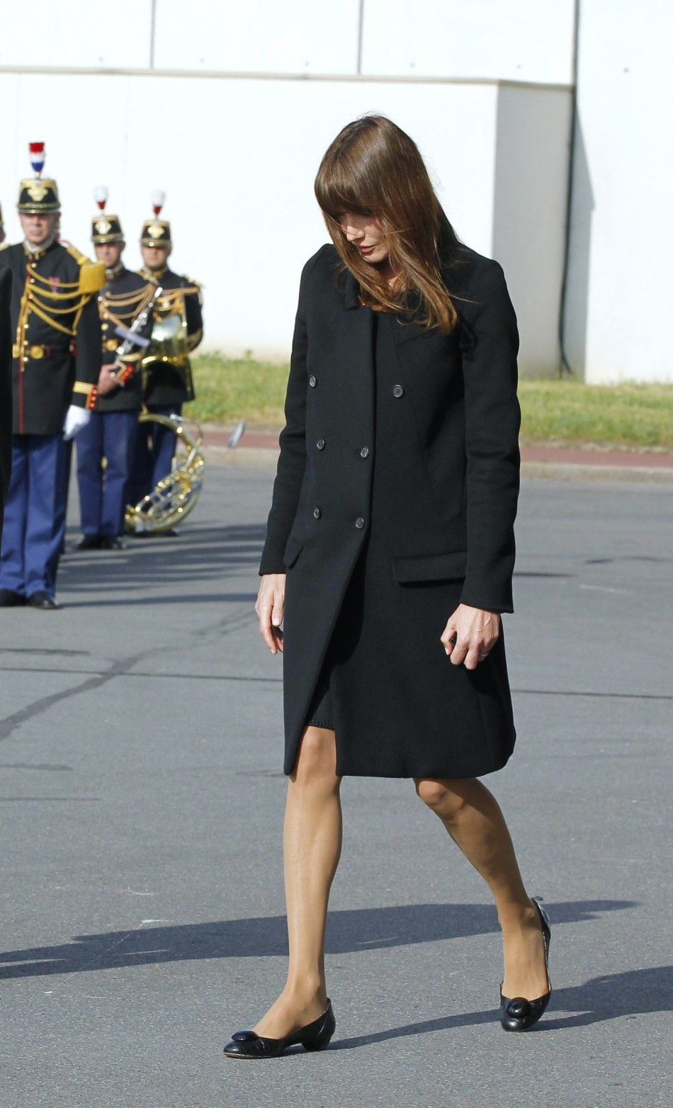 France039s First Lady Carla Bruni-Sarkozy arrives to attend a ceremony at Orly airport in memory of the eight French citizens who were killed in a bomb attack at cafe in Marrakesh