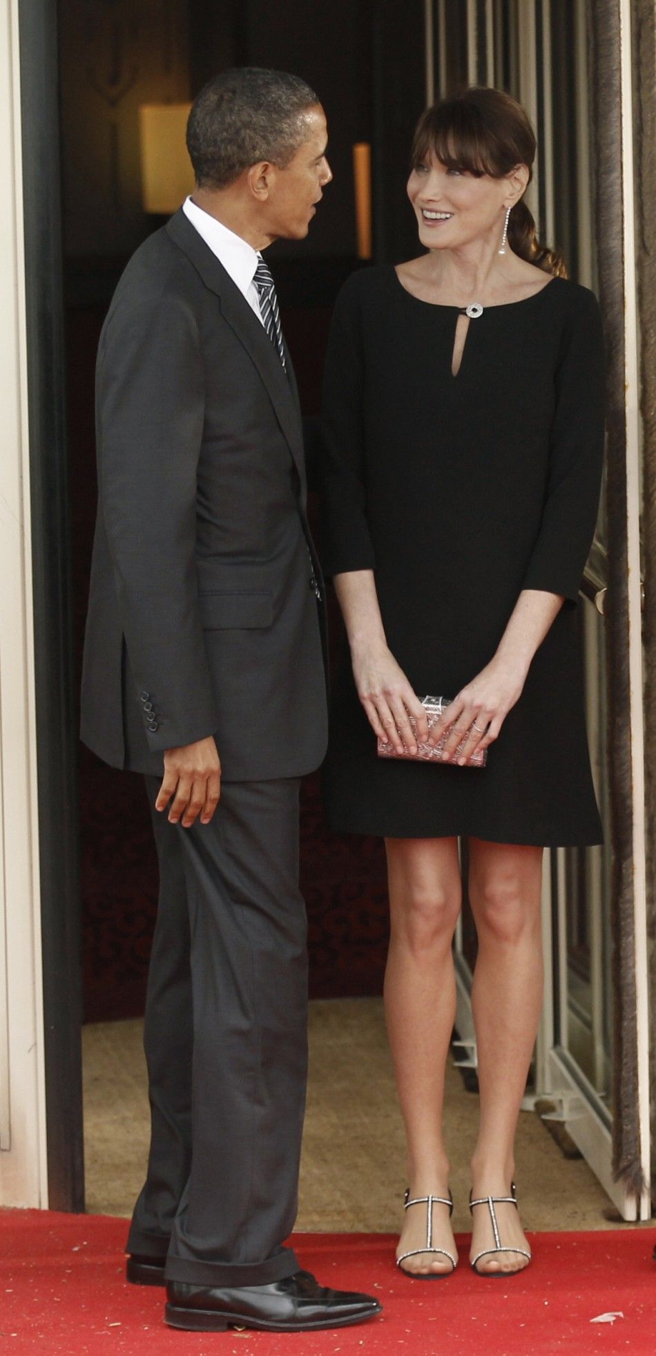 U.S. President Barack Obama is greeted by Carla Bruni-Sarkozy in Deauville