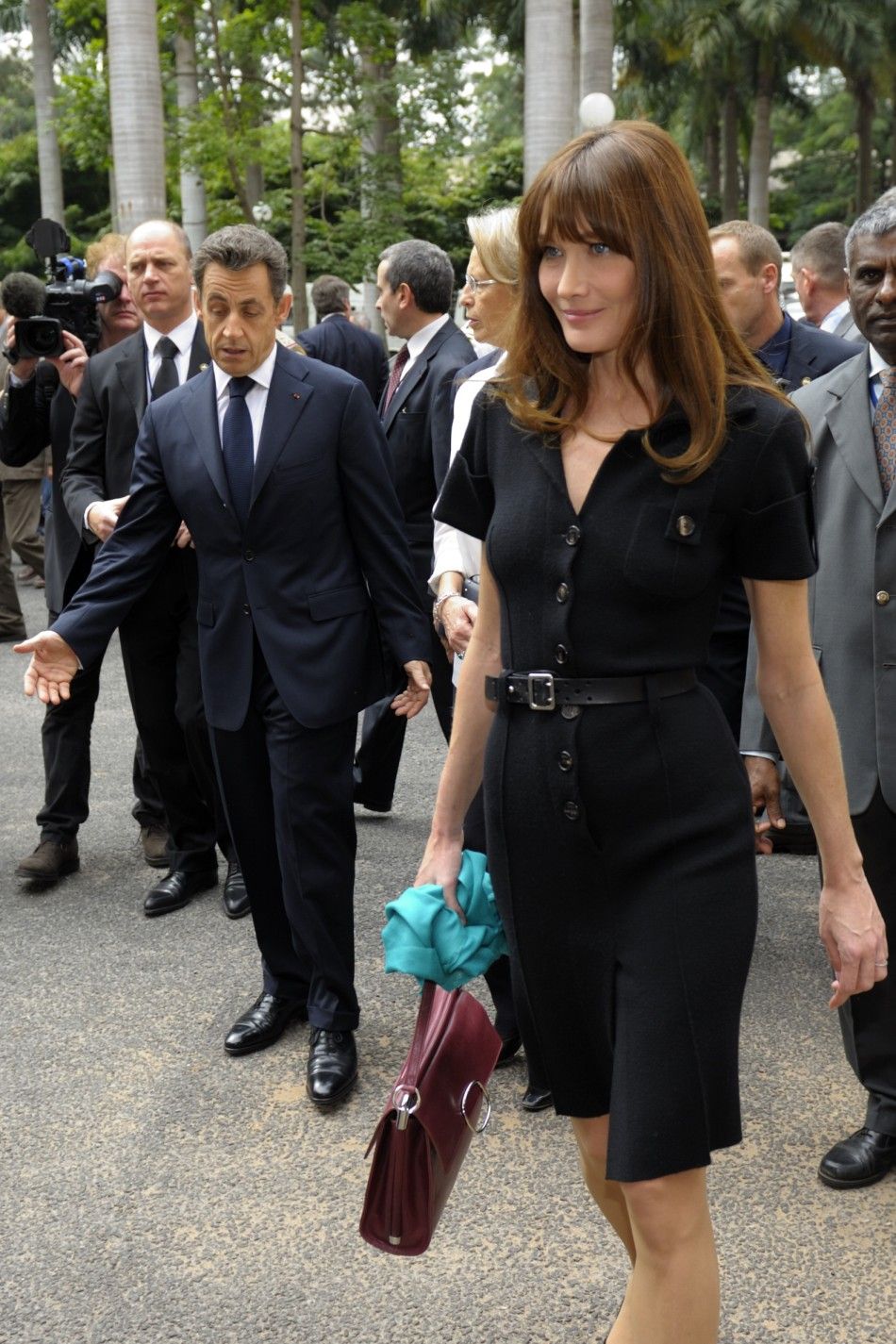 France039s President Sarkozy and First Lady Carla Bruni-Sarkozy leave a meeting at the ISRO satellite center in Bangalore