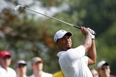 Tiger Woods of the U.S. tees off on the 12th hole during the second round of the WGC Bridgestone Invitational PGA golf tournament at Firestone Country Club in Akron