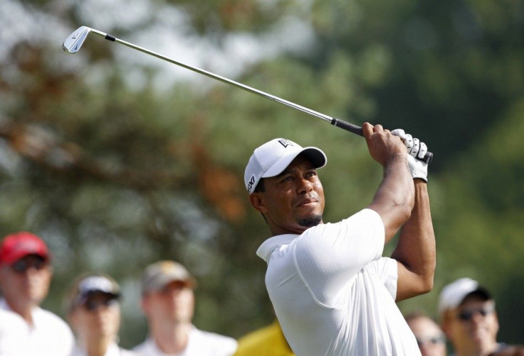 Tiger Woods of the U.S. tees off on the 12th hole during the second round of the WGC Bridgestone Invitational PGA golf tournament at Firestone Country Club in Akron