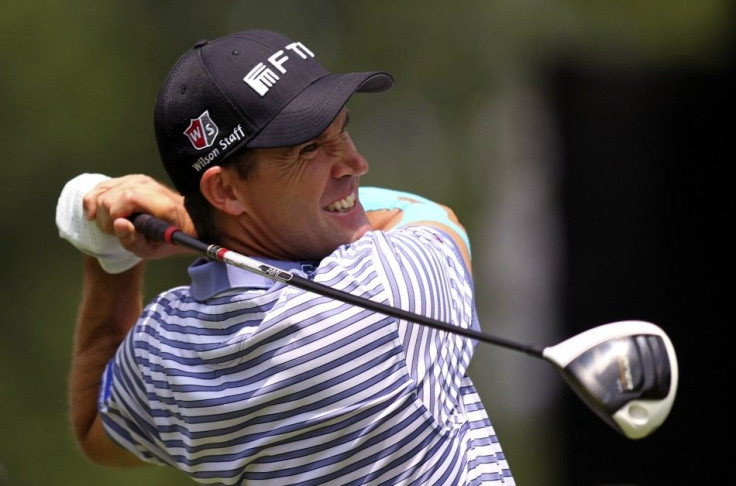 Ireland&#039;s Harrington tees off on 14th hole during first round of WGC Bridgestone Invitational PGA golf tournament at Firestone Country Club in Akron