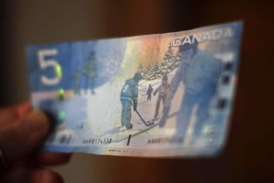 A Canadian five-dollar bill is seen in a posed photograph in Montreal.