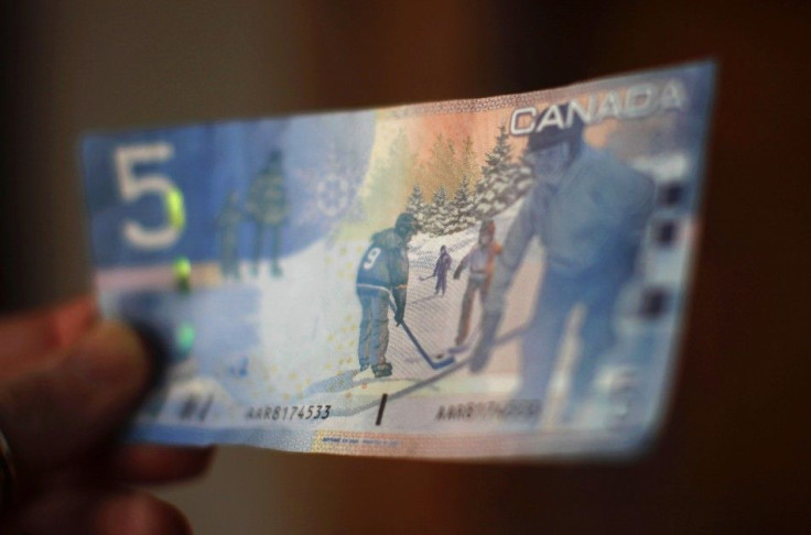 A Canadian five-dollar bill is seen in a posed photograph in Montreal.