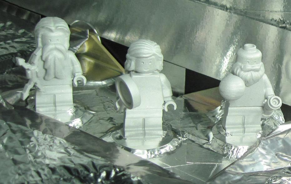 LEGO figurines representing the Roman god Jupiter, his wife Juno and Galileo Galilei are shown aboard the Juno spacecraft
