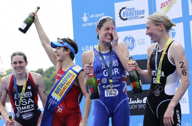 Barbara Riveros Diaz of Chile, Great Britain's Helen Jenkins and Anja Dittmer of Germany celebrate after the women's Triathlon