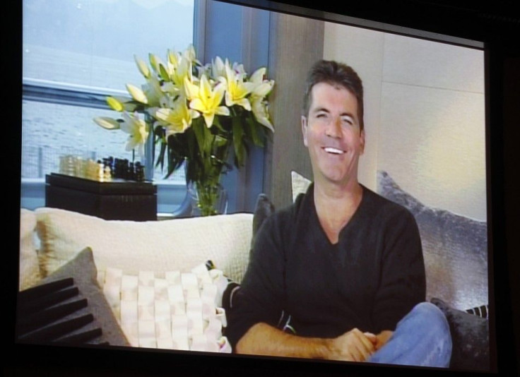 Simon Cowell, one of the judges on new reality series &#039;The X Factor&#039;, speaks via satellite at the FOX Summer TCA Press Tour in Beverly Hills