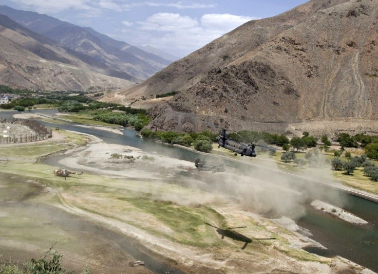 U.S. Chinook helicopters leave after a security handover ceremony in Panjshir province