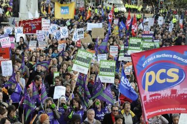 Public service union demonstrators take part in a protest march in Leeds
