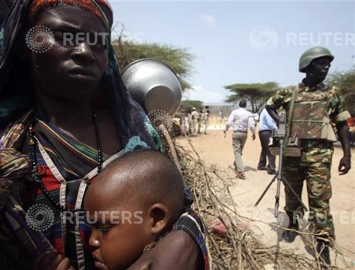 Internally displaced Somali women wait for food aid at a camp in the capital Mogadishu