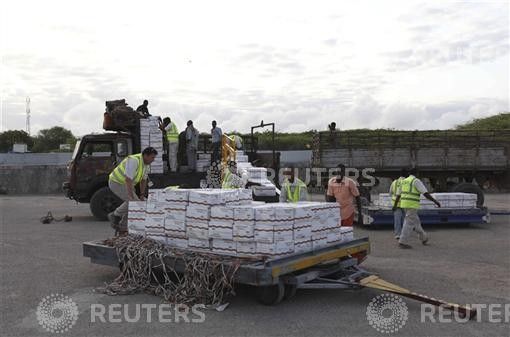 Some of the 10 tonnes of relief food from the World Food Programme WFP is loaded onto a truck at Mogadishu airport