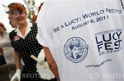 A woman dressed as Ricardo during attempt to set a new Guinness world record for the most Lucy lookalikes assembled in one place, in Jamestown