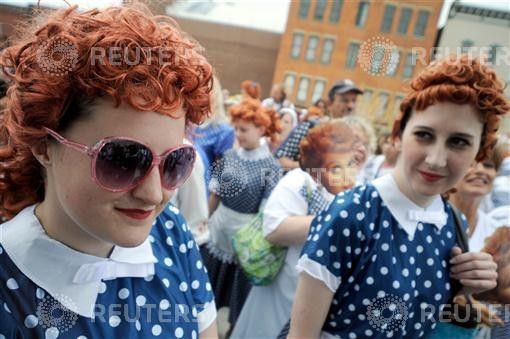 Women take part in an attempt to set a new Guinness world record for the most Lucy Ricardo lookalikes assembled in one place in Jamestown
