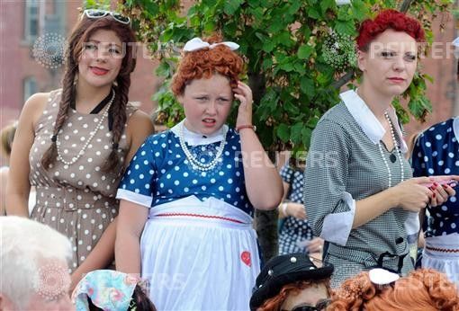 People take part in an attempt to set a new Guinness world record for the most Lucy Ricardo lookalikes assembled in one place in Jamestown