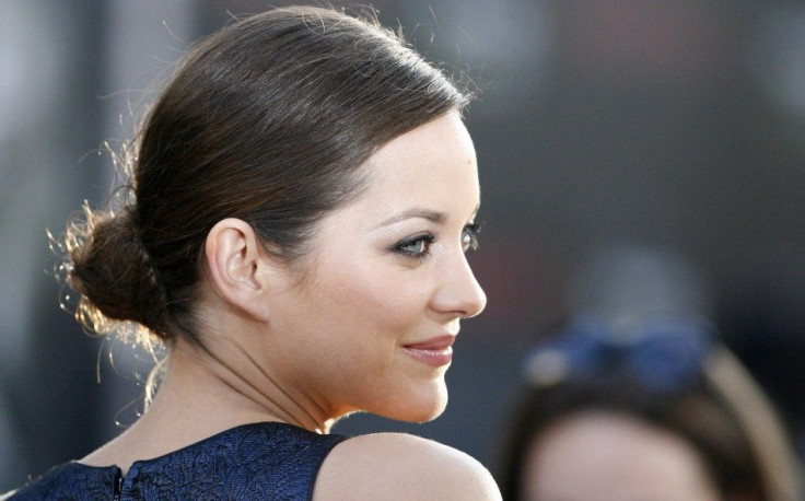 Cotillard poses at the premiere of "Inception" at the Grauman's Chinese theatre in Hollywood