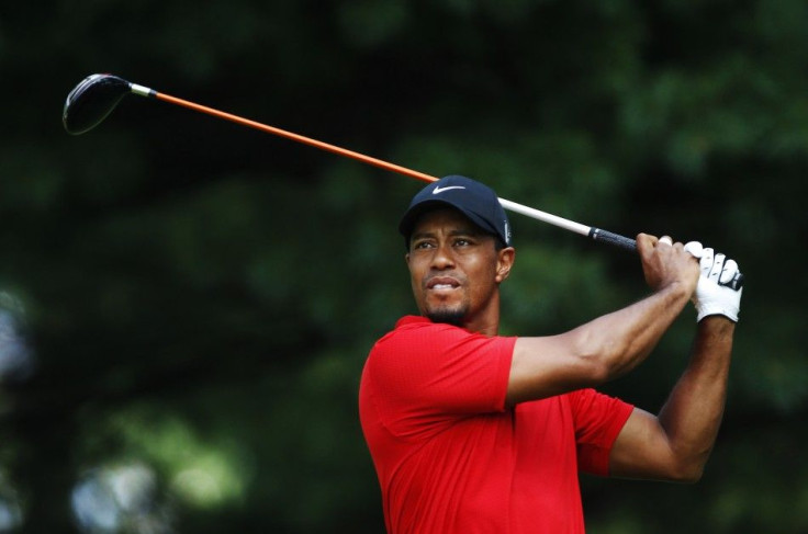 Tiger Woods of the U.S. tees off on the second hole during the final round of the WGC Bridgestone Invitational PGA golf tournament at Firestone Country Club in Akron