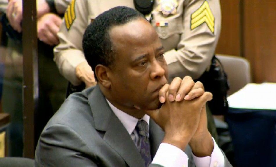 Dr. Conrad Murray listens as Judge Michael Pastor sentences him to four years in county jail for his involuntary manslaughter conviction of pop star Michael Jackson in Los Angeles