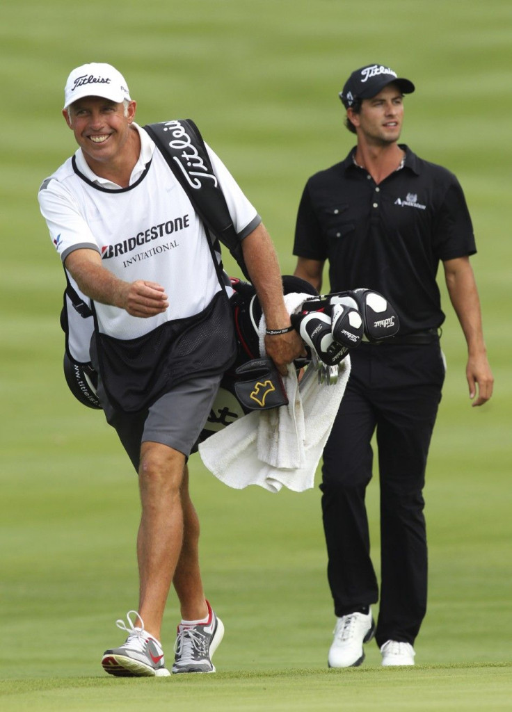 Williams, caddie for Australia&#039;s Scott, smiles as he walks with him to the 18th green as Scott won the WGC Bridgestone Invitational PGA golf tournament at Firestone Country Club in Akron