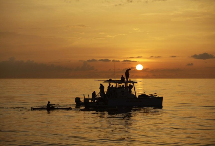 The sun sets as an assistance boat follows U.S. swimmer Diana Nyad during her attempt to swim to Florida from Havana.