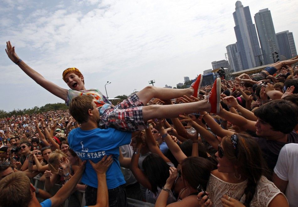 A music fan crowd surfs during a performance by quotFoster the Peoplequot at the Lollapalooza music festival in Grant Park in Chicago