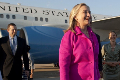 U.S. Secretary of State Clinton smiles upon her arrival in Naypyitaw, Myanmar